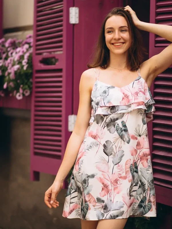 portrait-happy-woman-outside-cafe-decorated-with-flowers